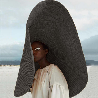 Stylish Ladies Straw Sun Hat showcased on a model, perfect for summer adventures and outdoor activities.
