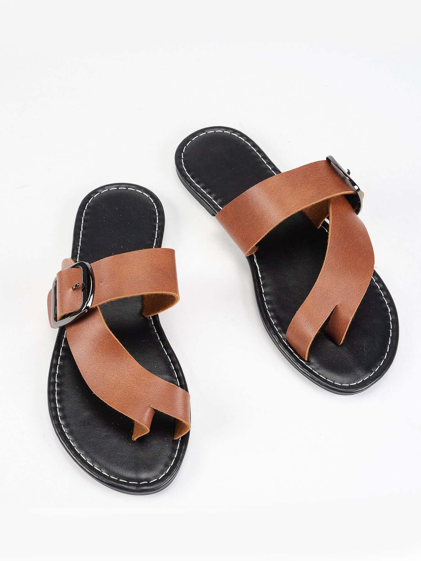 Ladies summer sandals in light brown with black soles and buckle design, offering style and comfort. Ideal for casual outings.