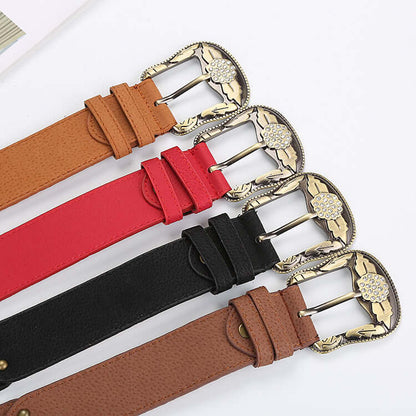 Assortment of Leather Floral Belts in brown, red, black, and tan with ornate metal buckles.