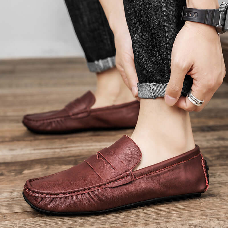 Wine red Leather Gommino Driving Shoes for men, featuring a solid pattern and tall crown, perfect for elegant comfort.