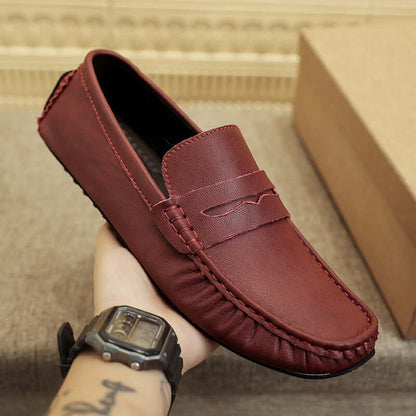 Wine red Leather Gommino Driving Shoe with tall crown, durable rubber sole, and solid pattern, offering style and comfort.