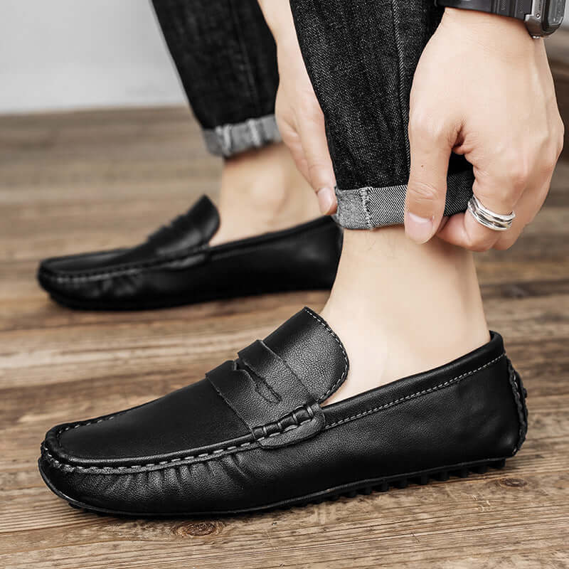 Black Leather Gommino Driving Shoes for men with durable rubber soles, showcasing elegance and comfort.