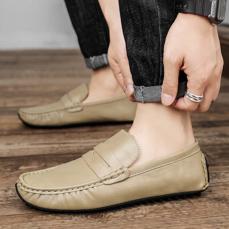 Man wearing khaki Leather Gommino Driving Shoes with durable rubber sole, showing stylish tall crown design.