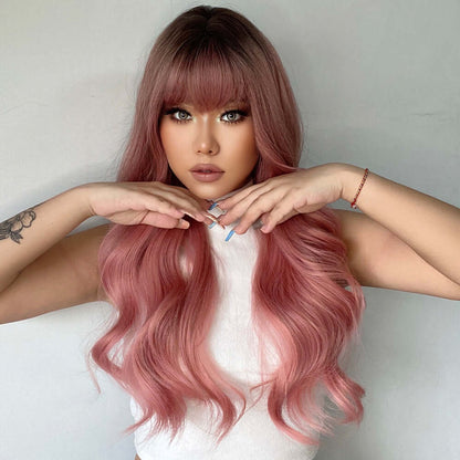 Woman wearing a loose wavy wig in pink, crafted with high-temperature silk, offering a natural and elegant hairstyle.
