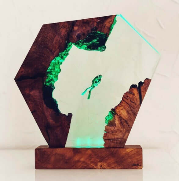 Unique Luminous Diver Night Lamp with geometric wooden design, glowing green light, perfect for bedroom decor.