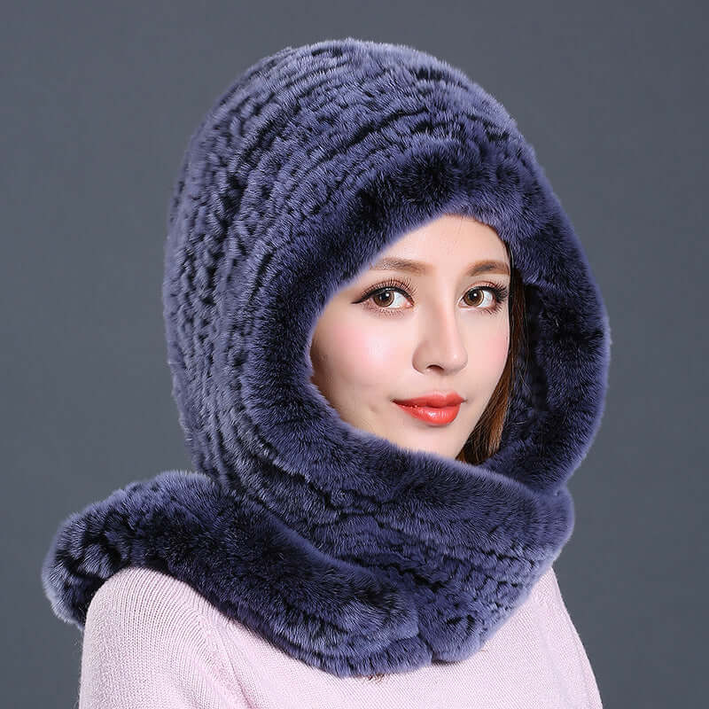 Elegant woman wearing a luxurious faux fur hat with scarf, perfect for winter fashion and warmth.