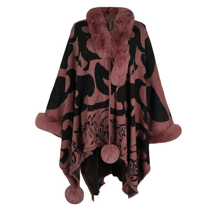Elegant faux fur shawl in burgundy with pom-pom details, perfect for adding warmth and style to any outfit.