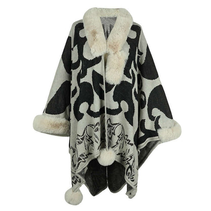 Elegant faux fur shawl with stylish black and gray patterns, perfect for adding warmth and luxury to your wardrobe.