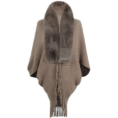 Stylish fur jacket shawl with fringe details, offering elegance and warmth for any occasion.