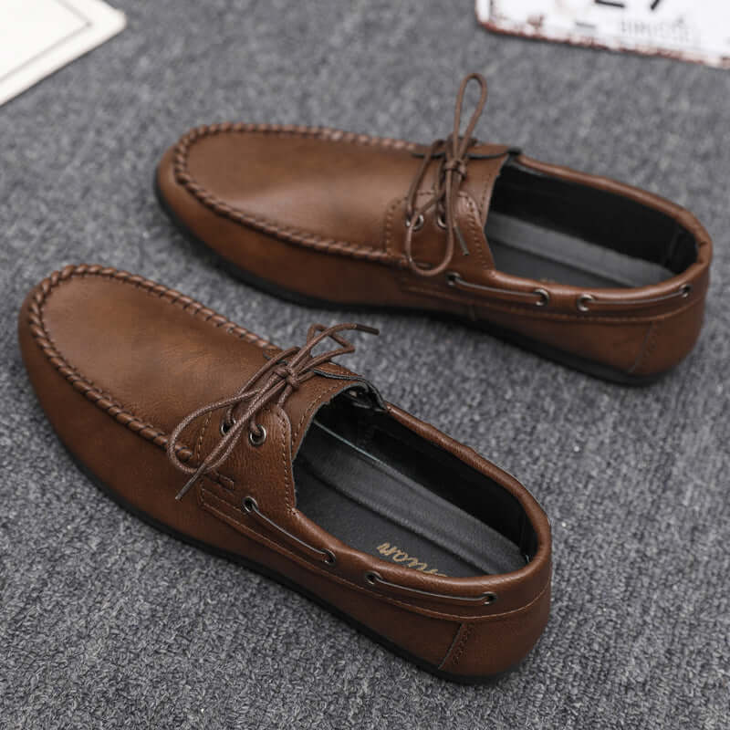 Brown Faux Leather Loafers with soft lining and lace detail, perfect for stylish comfort and durability.