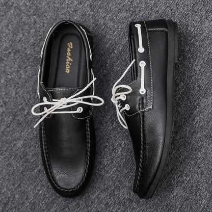 Black faux leather loafers with white laces, offering classic style and comfort, ideal for everyday wear.