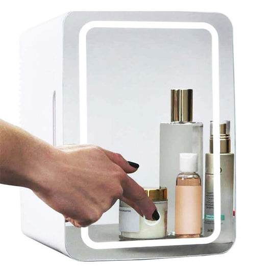 Mini Makeup Fridge featuring skincare products with a hand reaching for one inside the fridge.