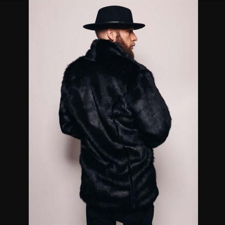 Man wearing a stylish Mink-like Faux Fur Coat and black hat, showcasing elegant winter fashion.