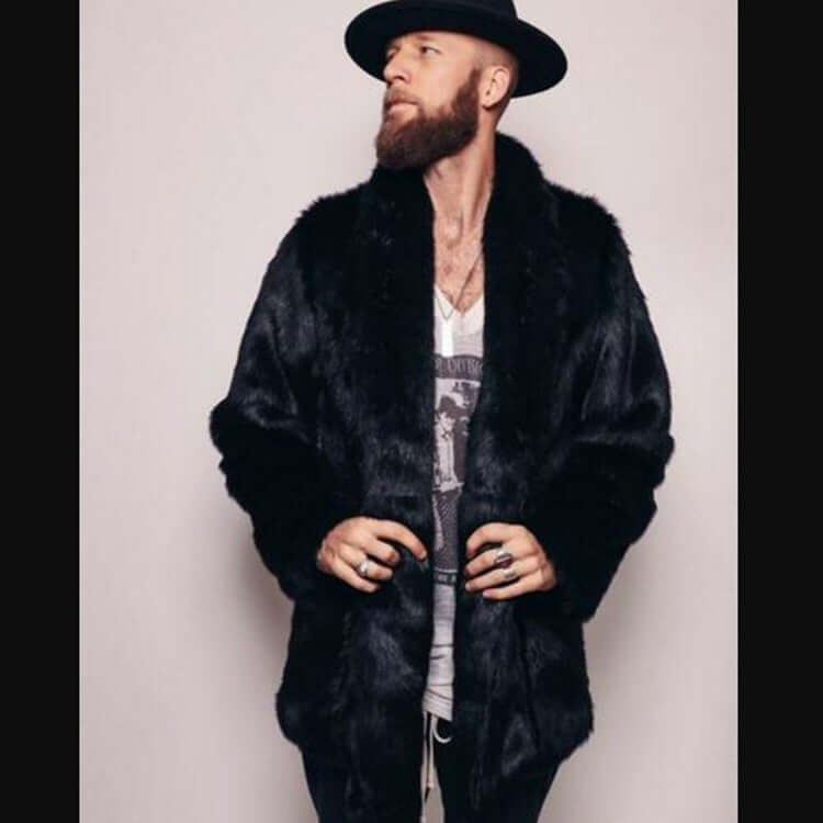 Man wearing a Mink-like Faux Fur Coat with a stylish hat, showcasing winter fashion elegance and comfort.