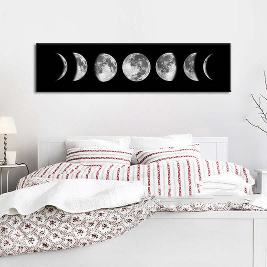 Home Decor Painting featuring a moon phase design above a cozy bed with patterned bedding.