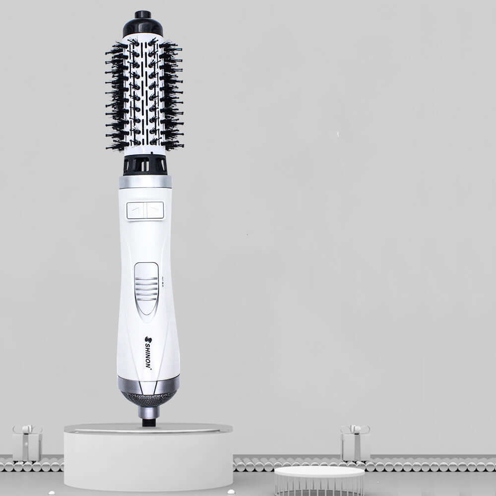 Multifunctional Hair Dryer Brush with dual air settings for drying, curling, and volumizing hair. Compatible voltage 220-240V.