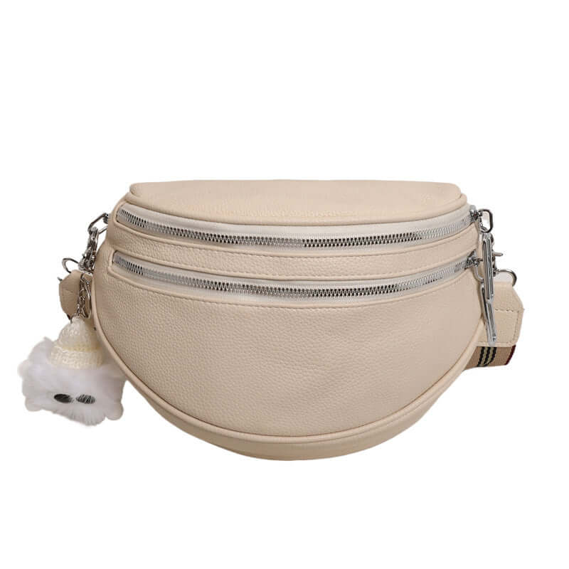 Stylish milky white ladies chest bag with PU material, silver zippers, and cute plush keychain. Perfect blend of urban simplicity.