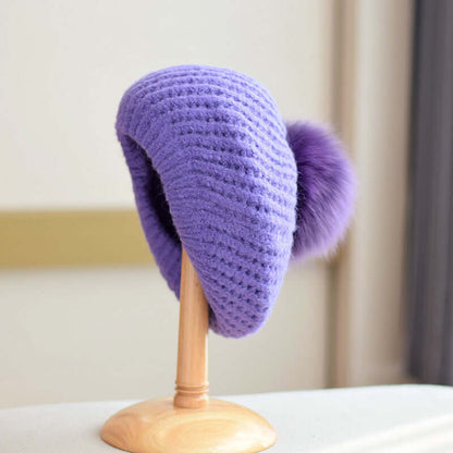 Fur Ball Hat in purple, showcasing stylish knit design and elegant fur pom-pom, perfect for winter warmth.