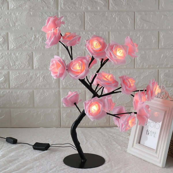 Rose Small Tree Lamp illuminating with soft pink flowers, perfect for elegant home decor and creative indoor lighting solutions.