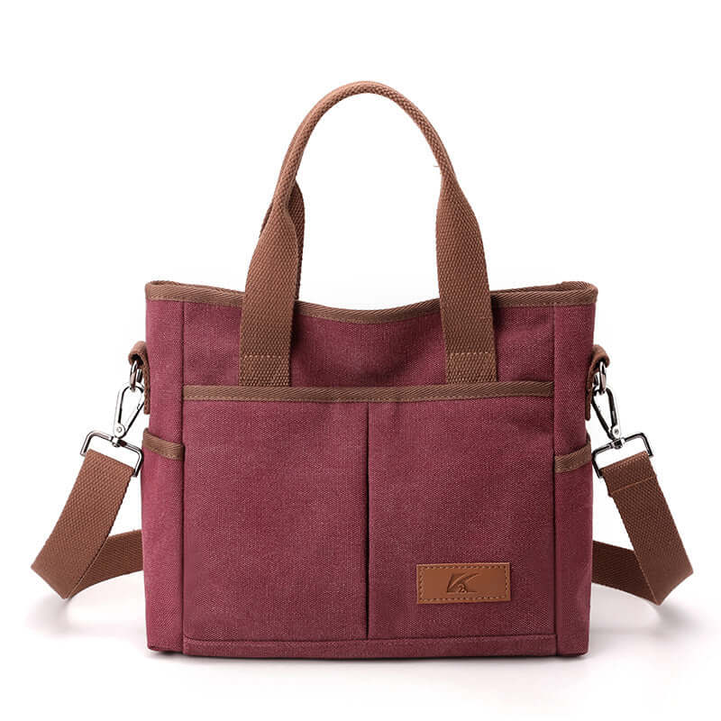 Simple Tote Bag in burgundy canvas with durable handles, front pocket, and detachable strap, ideal for everyday use.