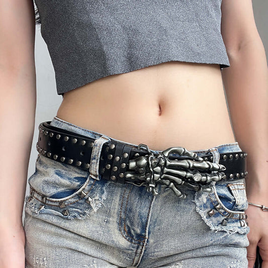 Close-up of a unique Skeleton Hands Belt worn by a model, showcasing its edgy design and studded details.