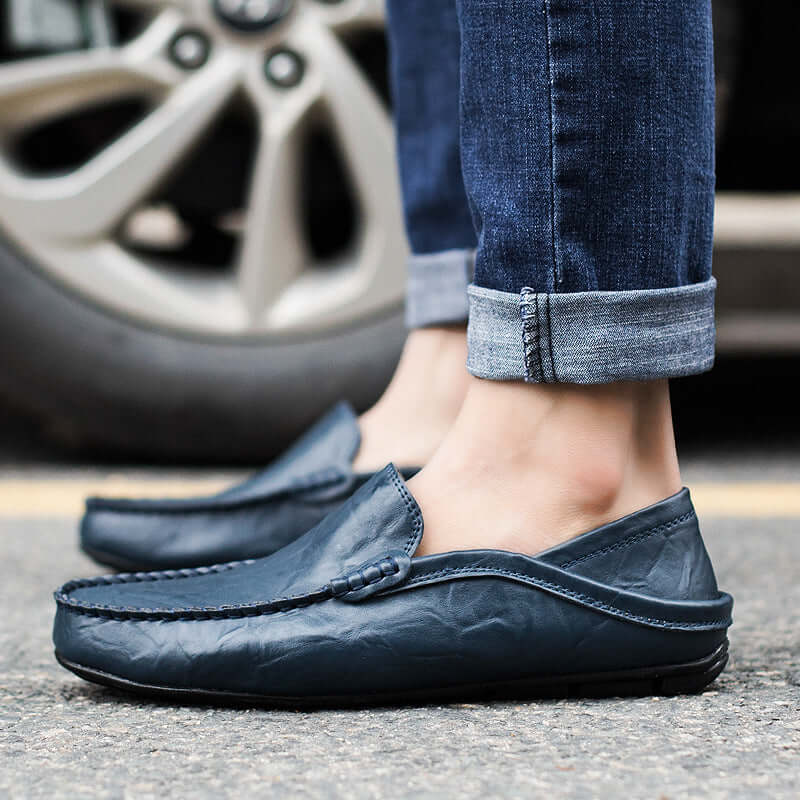 Person wearing blue Soft Bottom Leather Loafers with jeans, showcasing casual design and premium craftsmanship.