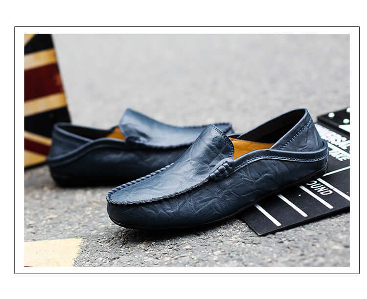 Blue Soft Bottom Leather Loafers on stone surface, showcasing premium craftsmanship and casual design.