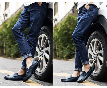 Person wearing blue Soft Bottom Leather Loafers with jeans, standing next to a car wheel. Stylish footwear for casual outfits.