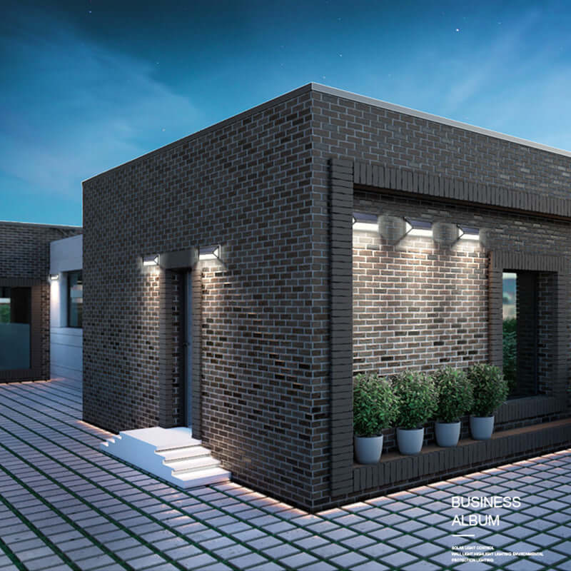 Modern house exterior with solar powered wall lights illuminating brick walls at night, enhancing outdoor decor and energy efficiency.