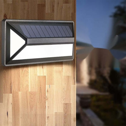 Solar Powered Wall Light illuminating outdoor space with eco-friendly elegance and enhanced aesthetics.