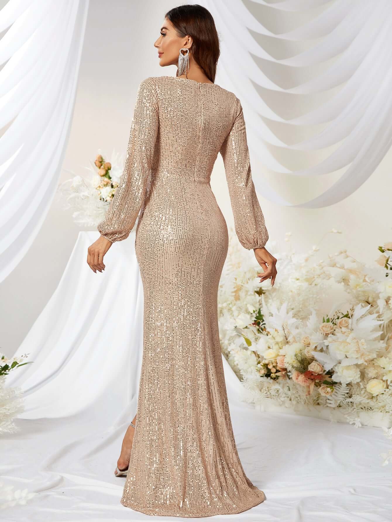 Elegant woman wearing a champagne-colored sparkly mermaid prom dress, showcasing a fitted silhouette and long sleeves.