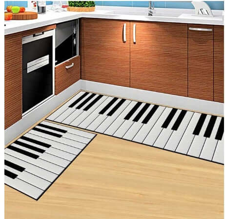 Stylish household floor mats featuring a piano keyboard design in a modern kitchen setting.