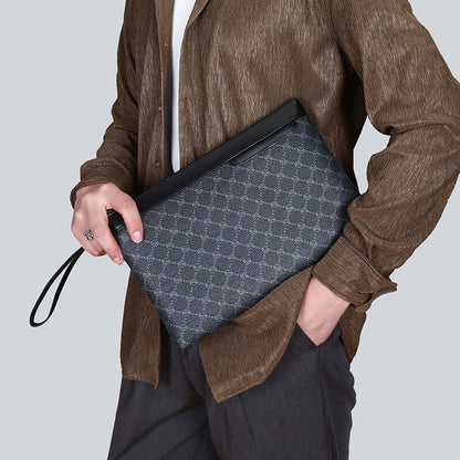 Elegant clutch hand bag in classic black PU material, held by a person in casual wear, showcasing its versatility and style.