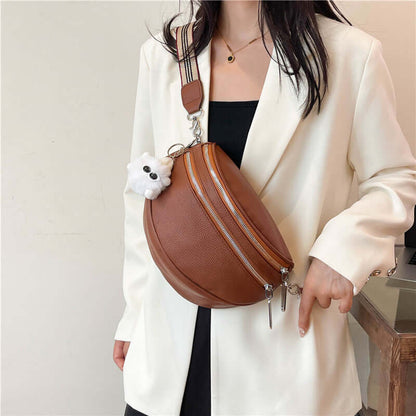 Brown PU ladies chest bag with slit pocket and cute accessory, worn over white blazer by a woman. Urban simplicity style.
