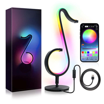 Symphony Atmosphere Table Lamp with color-changing LED display, remote control, and USB cable, elevating modern living spaces.
