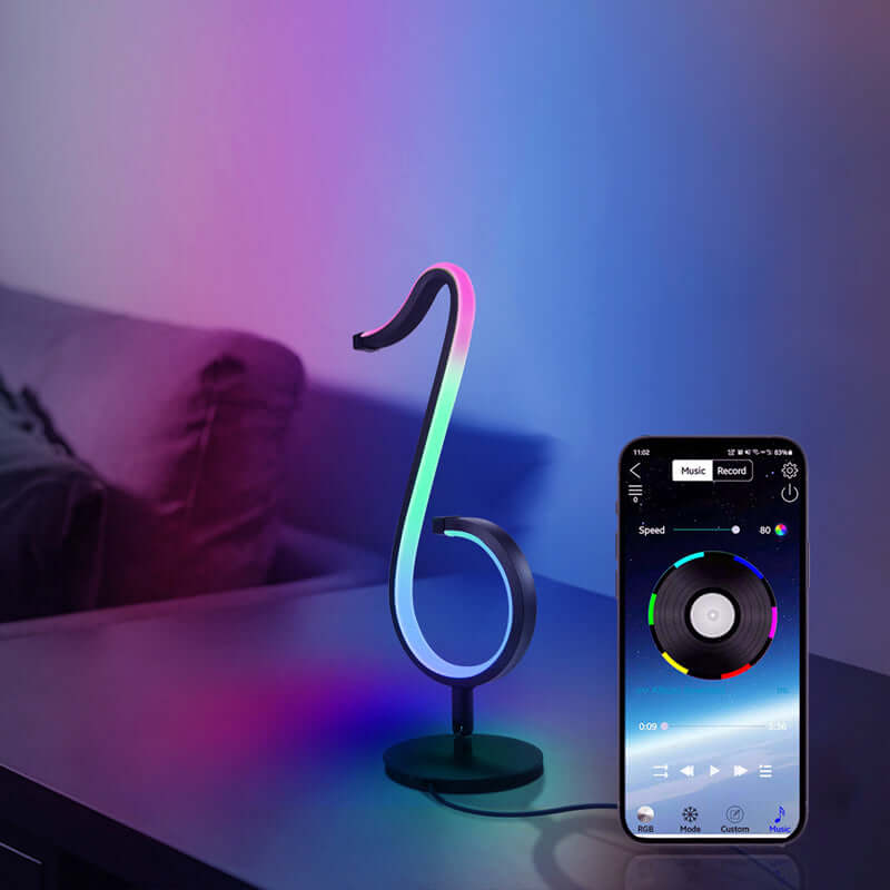 Symphony Atmosphere Table Lamp illuminating space with colorful LED lights, featuring a smartphone app control for ambiance customization.