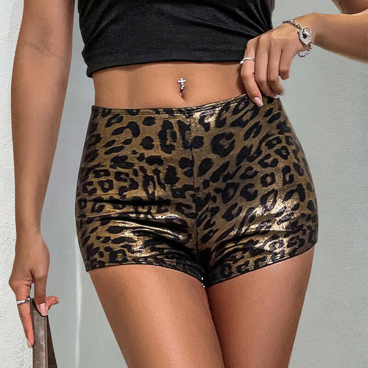 Woman wearing chic khaki Cheetah Shorts in leopard print, highlighting stylish low-waist design. Perfect for warm weather fashion.