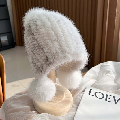 Stylish white Ear Muffs Hat featuring fur texture and pom poms, perfect for winter warmth and fashion.