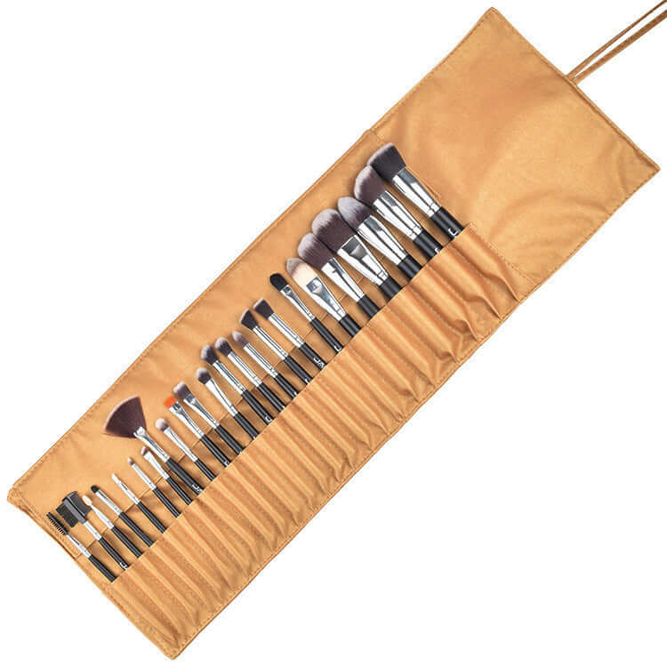 Kit of makeup brushes with synthetic fibers, featuring various sizes in a roll-up pouch, cruelty-free and hypoallergenic.
