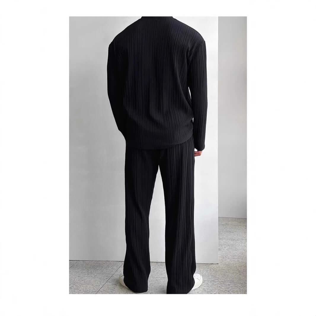 Back view of a black, relaxed-fit loungewear outfit showing top and pants, perfect for stylish comfort and cozy homewear.