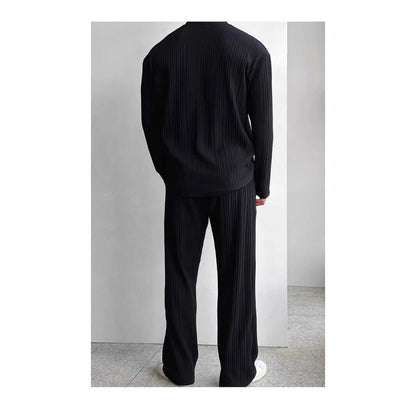 Back view of a black, relaxed-fit loungewear outfit showing top and pants, perfect for stylish comfort and cozy homewear.
