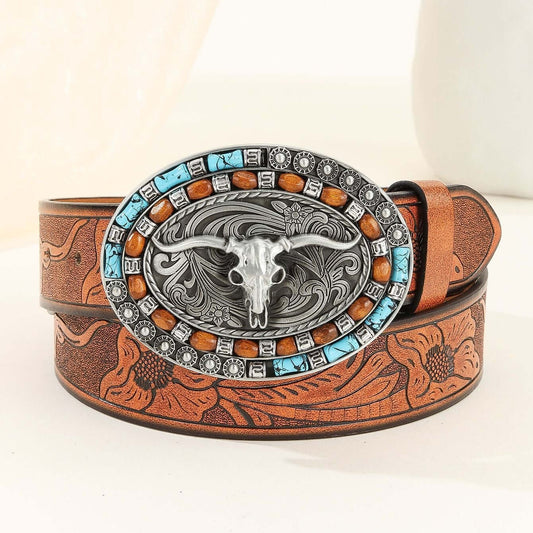 Vintage Cowboy Belt featuring intricate tooling and a silver bull skull buckle with turquoise and bead accents.