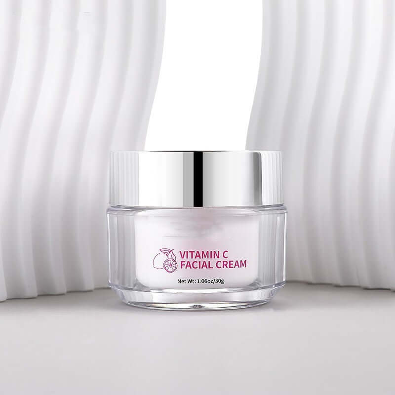 Vitamin C Facial Cream in elegant clear container with modern backdrop, ideal for nourishing and brightening skin. 30g size.
