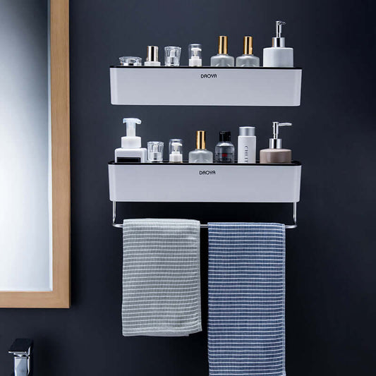 Stylish wall mounted shower caddies showcasing toiletries and towels, maximizing bathroom organization and space.