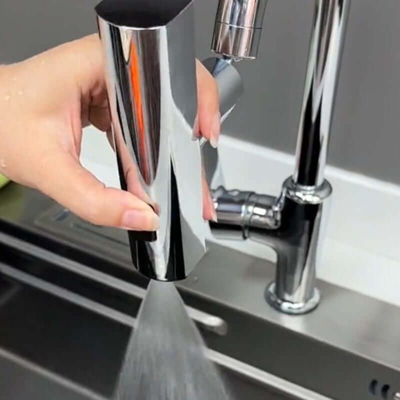 User operating a sleek Waterfall Kitchen Faucet, showcasing its modern design and efficient water flow.