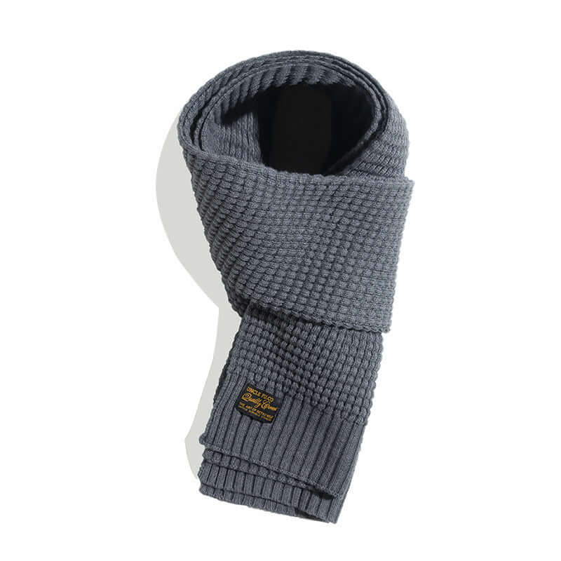 Stylish wool knitted scarf in classic gray, perfect winter fashion accessory for warmth and style.